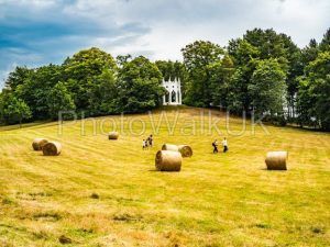 Painshill Park, Cobham Surrey, England.  4 August 2019. Family running through a field - Photo Walk UK