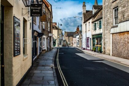 Tetbury, Gloucestershire, United Kingdom April 22 2012. View of a typical street with signs and road markings - Photo Walk UK