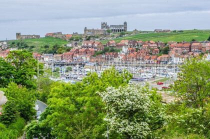 Whitby, North Yorkshire, England. June 10 2013. View across harbour towards the Abbey - Photo Walk UK